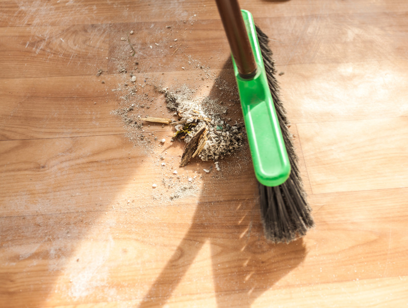 brush cleaning pile of debris